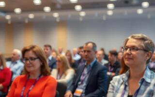 Engaged audience at a business conference in a modern seminar room during a morning session photo
