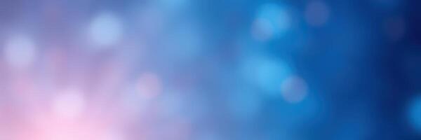 Colorful abstract background with soft bokeh effects illuminated in shades of blue and pink at dusk photo