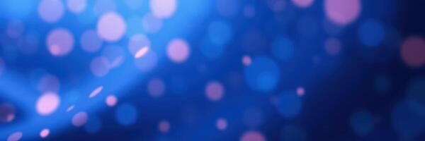 Colorful bokeh lights create an enchanting atmosphere in a vibrant blue background during a festive event photo