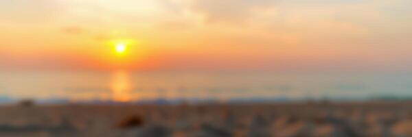 Stunning sunset over the ocean creates a serene atmosphere at the beach during twilight photo