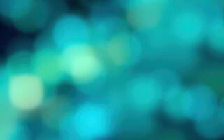 Vibrant colors create a soft, dreamy background with bokeh effect in varying shades of blue and green for artistic visuals photo