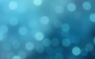 Beautiful blue bokeh background creating a serene and calming atmosphere for design and decoration photo