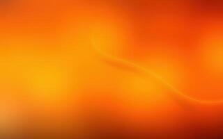 Warm tones swirl softly in an abstract representation of a sunset or warm atmosphere photo