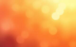 Colorful abstract background featuring warm orange and yellow tones with soft bokeh effects in a vibrant gradient photo