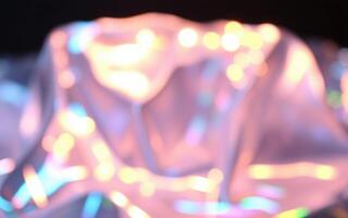 Colorful foil surface reflecting light creates a dreamy and abstract aesthetic in a soft-focus composition photo