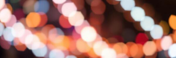 Colorful lights create a festive atmosphere during a nighttime celebration in an urban setting photo