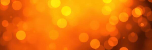 Vibrant bokeh background with warm golden hues during evening hours in a festive atmosphere photo