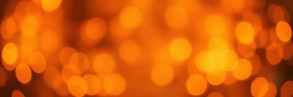 Bright orange bokeh lights create a warm atmosphere in a cozy setting during evening hours photo