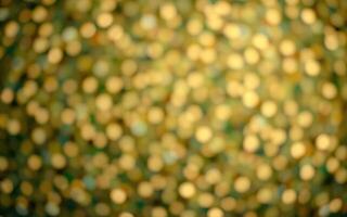 Golden bokeh background with shimmering lights for festive occasions photo