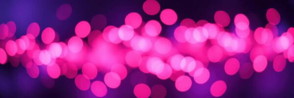 Vibrant pink bokeh lights create a dynamic atmosphere at an evening event in an urban setting photo
