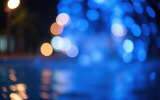 Colorful fountain illuminated at night creates a vibrant atmosphere by the water in a public space photo