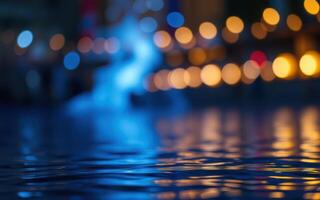 Nighttime reflections on water surface illuminated by distant lights creating a serene atmosphere photo