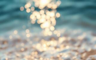 Sunlight reflecting on gentle ocean waves creates a serene atmosphere at a sandy beach in the afternoon photo