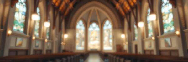 Beautiful interior of a historic church featuring stained glass windows and wooden beams during daylight hours photo