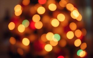 Warm glow of festive lights on a Christmas tree during the holiday season in a cozy living room setting photo