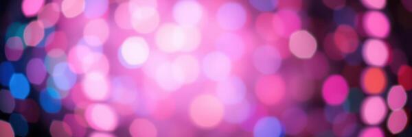 Colorful abstract background with blurred lights creating a vibrant atmosphere for celebrations and events photo
