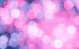 Vibrant bokeh lights create a dreamy atmosphere in soft pink and blue tones during a nighttime event photo
