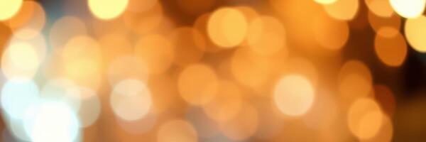 Warm golden bokeh lights create a cozy atmosphere for evening gatherings and celebrations photo