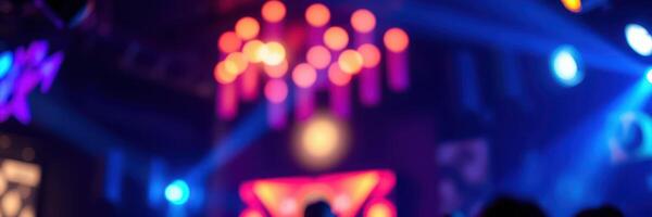 Vibrant nightlife atmosphere with colorful lights and energetic crowd dancing at a club during a lively event photo