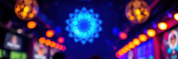 Colorful lights create a vibrant atmosphere in a lively indoor venue during a late-night event photo