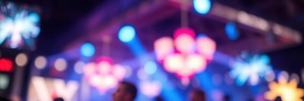 Colorful light display at a lively dance party in a vibrant indoor venue during the night photo