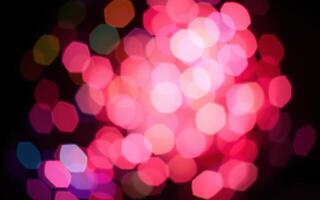 Vibrant display of colorful bokeh lights at a night festival, creating a festive atmosphere in the city square photo