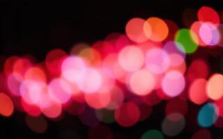 Colorful light patterns create a vibrant atmosphere during a night event in an urban setting, adding energy and excitement to the surroundings photo