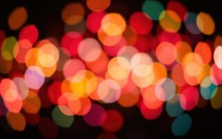Vibrant display of colorful lights creating a festive atmosphere in a dimly lit space photo