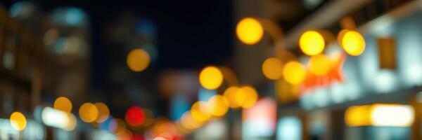 City street illuminated by lights at night with a vibrant atmosphere and blurred background details photo