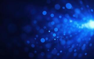 Blue abstract background with glowing particles creating a dynamic visual effect in a dark space photo