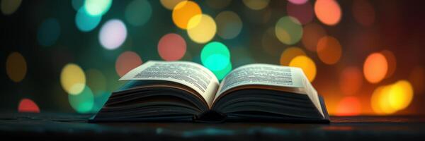 Open book with illuminated pages resting on a table amidst colorful bokeh lights in a cozy atmosphere photo