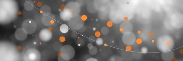 Colorful bokeh background with orange dots and soft white lights in an artistic composition photo