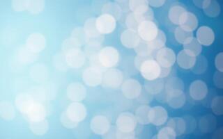 Soft blue bokeh lights create a tranquil atmosphere in a serene setting during daytime photo