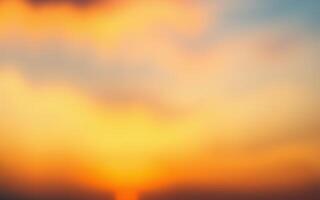 Vibrant sunset over a tranquil horizon with soft clouds illuminated by warm colors photo