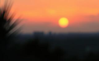 Beautiful sunset behind hills creates a calming atmosphere in the evening sky photo