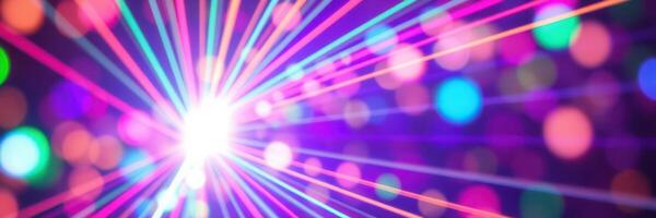 Colorful light beams create a vibrant atmosphere at a night event with disco balls and lively music photo