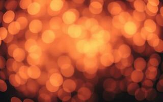 Warm orange and yellow glow illuminates a dark space during a fire or festive occasion photo