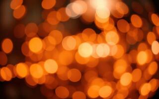 Warm orange lights create a cozy atmosphere in a dimly lit indoor space during evening hours photo