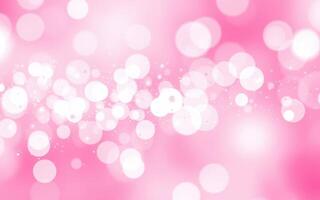 Delicate pink bokeh background with soft white highlights creating a dreamy atmosphere for various design projects photo