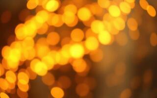 Warm golden bokeh lights create a cozy atmosphere during a festive evening gathering at a local event photo