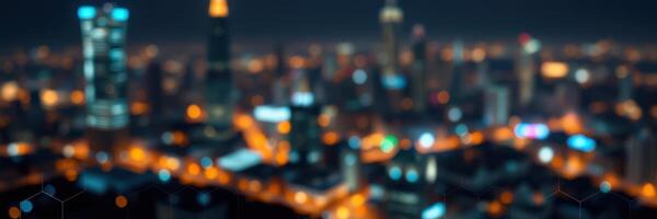 City skyline illuminated by vibrant lights at night displaying urban life and modern architecture photo