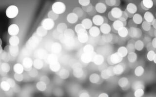 Bright out-of-focus lights create a soft and dreamy atmosphere during a festive evening celebration photo