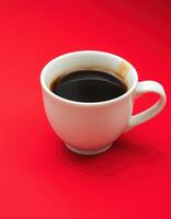 Freshly brewed black coffee in a white cup on a vibrant red background photo