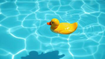 Rubber duck floats gently in a sparkling blue swimming pool under sunlight photo
