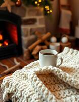 Cozy winter morning with coffee by the fireplace in a warm, inviting living room photo