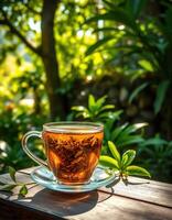 Enjoying a calming cup of herbal tea in a lush garden on a bright sunny day photo