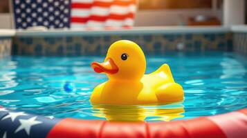 Bright yellow rubber duck floats in a pool surrounded by an American flag during a sunny day photo