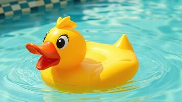 Bright yellow rubber duck floats in a clear swimming pool on a sunny day photo