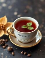 Warm herbal tea served in an elegant cup with a mint leaf garnish highlights a cozy setting photo