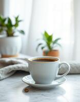 Comforting cup of coffee beside plants in a sunlit room with gentle curtains photo